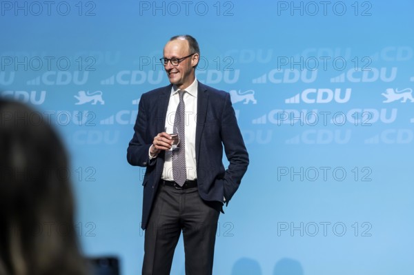 New Year's reception of the CDU with chancellor candidate Friedrich Merz in Künzelsau. The Federal Chairman of the CDU and Chairman of the CDU-CSU parliamentary group spoke to an audience of 2000 at the Carmen Würth Forum. Portrait during his speech on stage. Künzelsau, Baden-Württemberg, Germany, Europe