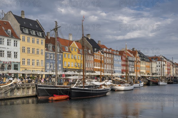 Nyhavn, in the Frederiksstaden district, harbour district with houses over 300 years old, moored sailing boats, promenade with many cafés, pubs, restaurants, canal, tourist attraction, Copenhagen, Denmark, Europe