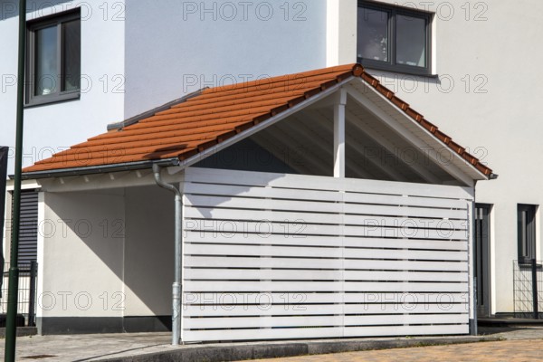Modern and high-quality wooden carport on a detached house