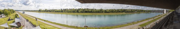 Wide panorama of a river flowing through a wooded landscape, Oberschleißheim regatta course