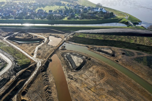 Dinslaken, North Rhine-Westphalia, Germany, Emscher estuary into the Rhine. In front, the construction site of the new Emscher estuary. The mouth of the Emscher into the Rhine is being moved almost 500 metres north from Dinslaken to Voerde. Fish will then be able to swim barrier-free up the new Emscher from the Rhine through a newly created floodplain area. Following the construction of a parallel sewer, the Emscher has been completely free of sewage since January 2022. The river was previously an open, above-ground combined sewer with rainwater and wastewater, Europe