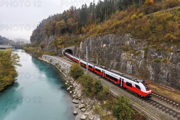 Train of the S-Bahn Vorarlberg of the Austrian Federal Railways ÖBB Eisenbahn Nahverkehr in autumn in Feldkirch, Austria, Europe
