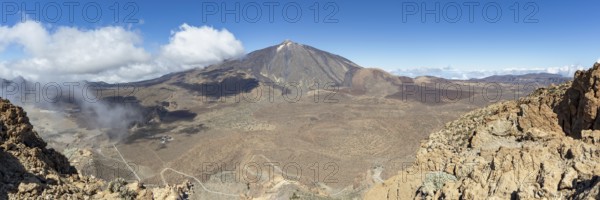 Panorama during the ascent to Alto de Guajara, 2715m, to the bizarrely shaped rock formations of volcanic rock, Roques de García, the visitor centre and the Hotel Parador, behind it the Pico del Teide, 3717m, Teide National Park, Parque Nacional del Teide, Tenerife, Canary Islands, Spain, Europe