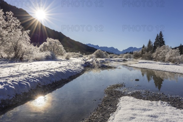 Wild river, riverbed, winter, snow, hoarfrost, sunbeams, backlight, Isar, view of Zugspitze, Wetterstein mountains, Bavaria, Germany, Europe