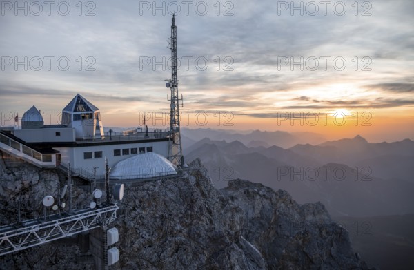 Mountain station of the Tyrolean Zugspitze railway at the summit of the Zugspitze, at sunset, Wetterstein Mountains, Northern Limestone Alps, Bavaria, Germany, Europe