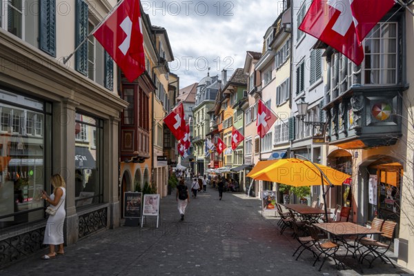 Alley decorated with Swiss flag in the old town, Zurich, Switzerland, Europe