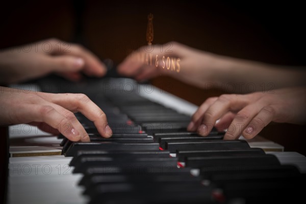 Hands of a young pianist playing on the keyboard of a Steinway & Sons grand piano, Stuttgart, Baden-Württemberg