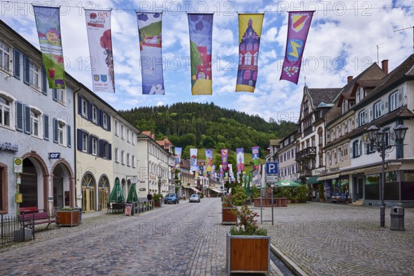 Historic buildings, old town, cobblestones, town festival, flags for the town anniversary, main street, Wolfach, Black Forest, Ortenaukreis, Baden-Württemberg, Germany, Europe