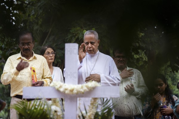 People from Christian community light candles and offer prayers on the grave of their relative during the All souls day observation, in Guwahati, India on 2 November 2024. All Souls' Day is a Christian holiday dedicated to honoring and praying for the souls of the departed