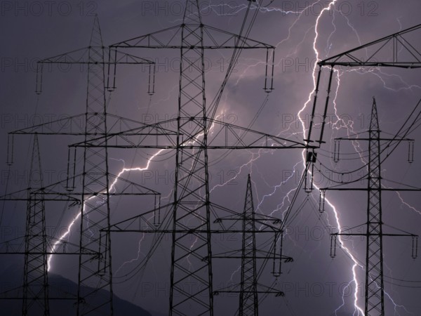 Power pylons in a thunderstorm, lightning, Lower Saxony, Federal Republic of Germany
