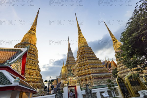 Wat Pho temple at sunset. Bangkok's oldest Buddhist monastery near the Grand Palace. Four chedis are among the most precious in Bangkok. Bangkok, Thailand, Asia
