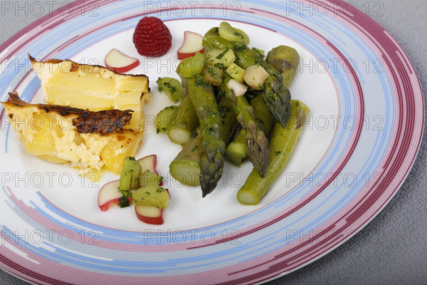 South German cuisine, green asparagus with rhubarb vinaigrette and potato gratin, healthy, vegetables, plated, vegetarian, traditional cuisine reinterpreted, food photography, studio, Germany, Europe