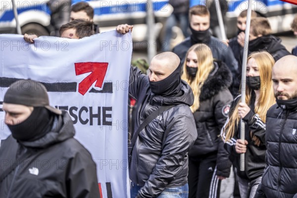The neo-Nazi group Jung und Stark, JS, demonstrates in the city centre of Essen, demanding the remigration of foreigners, chanting Deutschland den Deutschen Ausländer raus, approx. 150 ultra right-wingers, dressed in black and wearing typical scene clothing, several groups demonstrate against the Nazi march, Essen, North Rhine-Westphalia, Germany, Europe