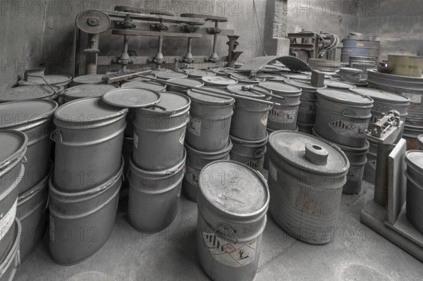 Metal barrels covered with zinc dust in the filling room for zinc powder of a metal powder mill, founded in 1900, Igensdorf, Upper Franconia, Bavaria, Germany, Europe
