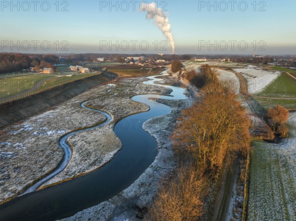 Recklinghausen, Castrop-Rauxel, North Rhine-Westphalia, Germany, winter landscape, EMSCHERLAND construction project, a 37-hectare water and nature discovery park at the water crossroads of the Rhine-Herne Canal and the renaturalised Emscher on the city limits of Recklinghausen and Castrop-Rauxel. The ecological focal point at the confluence of the Suderwicher Bach (left) and Emscher (right) will also be a future garden for the International Garden Exhibition 2027. Before the renaturalisation, the Emscher river system was an open, above-ground wastewater channel, combined sewer with surface water and wastewater. The Uniper power plant Datteln 4 in the background, Europe