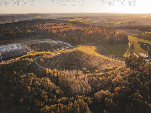 Factory next to autumnal hills and forests from an aerial perspective, Lindenrain industrial estate, Gechingen, Black Forest, Germany, Europe