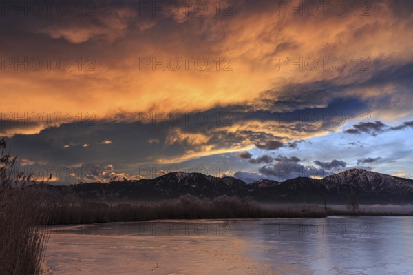 Dawn, clouds over a lake in front of mountains, winter, Riegsee, near Murnau, Bavaria, Germany, Europe