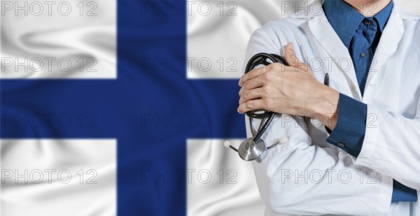 Doctor with stethoscope on Finland flag. Doctor holding stethoscope on Finland flag