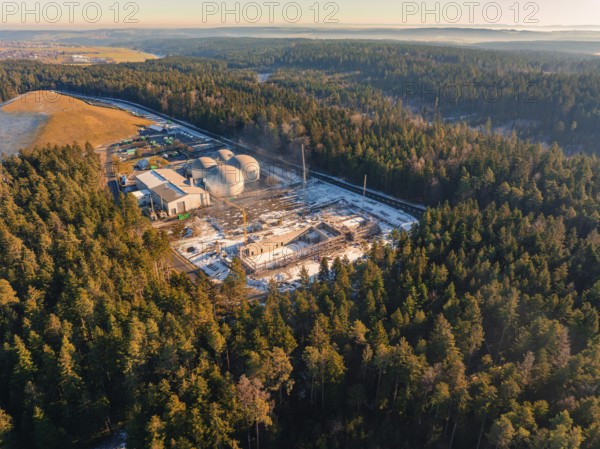 Wide view of a wintry forest area with a construction site and industrial plant, new fire station, Oberhaugsett, district of Calw, Germany, Europe