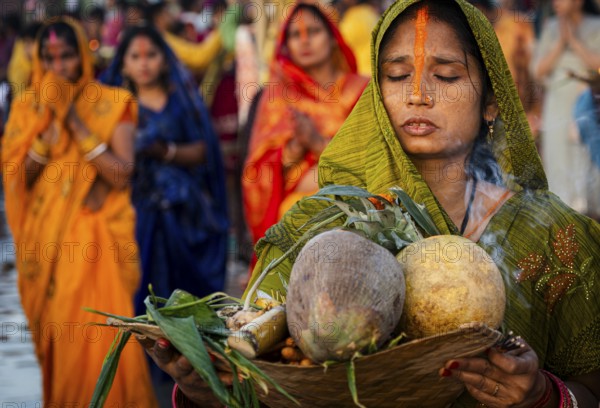 Hindu devotees perform rituals as they offer prayers to the Sun god in the bank of Brahmaputra river on the occasion of the 'Chhath Puja' festival in Guwahati, Assam, India on 7 November 2024. Chhath Puja is a significant Hindu festival celebrated primarily in the Indian states of Bihar, Jharkhand, Uttar Pradesh, and in Nepal. Dedicated to the worship of the Sun God (Surya) and his wife Usha (also referred to as Chhathi Maiya), this festival seeks blessings for prosperity, health, and longevity