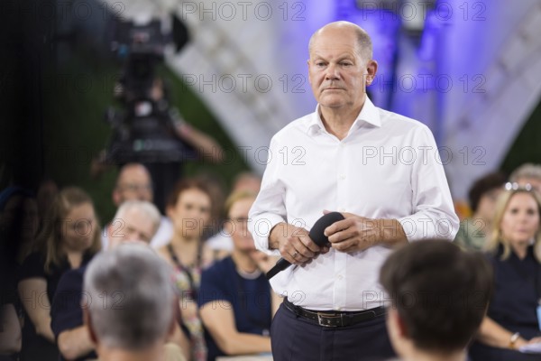 Olaf Scholz (Chancellor of the Federal Republic of Germany, SPD) surrounded by guests at the Chancellor's meeting at ufaFabrik in Berlin on 4 September 2024