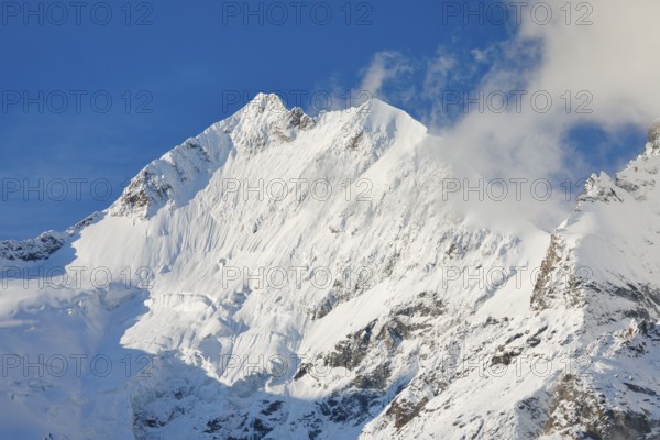 Freshly snow-covered summit of Piz Bernina and Biancograt, Engadin in the canton of Graubünden, Switzerland, Europe