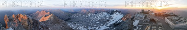 Sunset, Alpine panorama, aerial view, Zugspitze with summit cross, Zugspitzbahn and Zugspitzplatt with glacier, high mountains, Bavaria, Germany, Europe