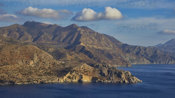 Mountains and sea under a cloudy sky, morning light, sunrise, coastal road, east coast, Karpathos, Dodecanese, Greek Islands, Greece, Europe