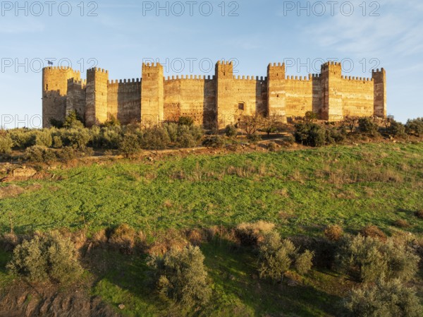 The impressive Moorish Burgalimar castle at the town of Baños de la Encina. Drone shot. Jaén province, Andalusia, Spain, Europe