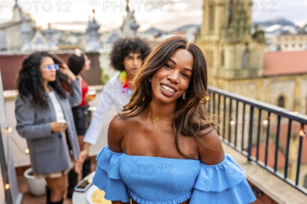Stylish beauty woman in summer dress smiling while friends partying outdoors