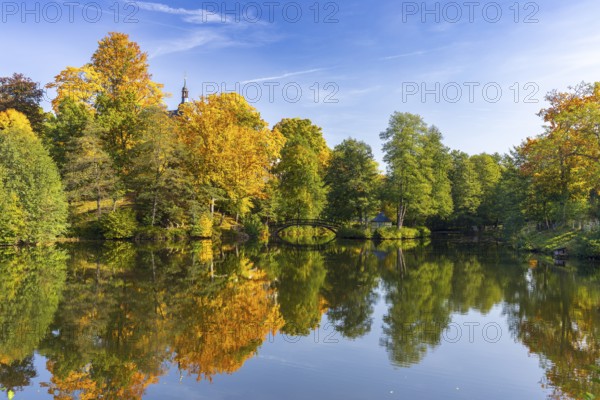 Castle pond with bridge and Pfaffroda Castle in autumn, Olbernhau, Erzgebirge, Saxony, Germany, Europe