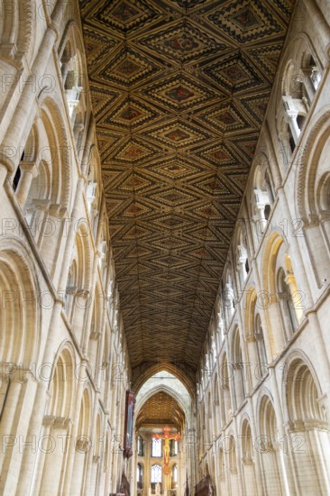Interior of cathedral church, Peterborough, Cambridgeshire, England, UK looking up at ceiling and sculpture of Jesus Christ on Cross