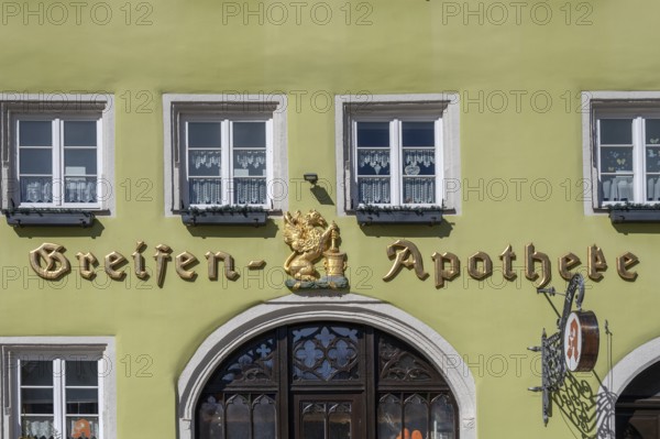 Lettering and griffin figure above the entrance of the Greifen Apotheke, since 1694, Marktpl. 10, Weißenburg, Middle Franconia, Bavaria, Germany, Europe
