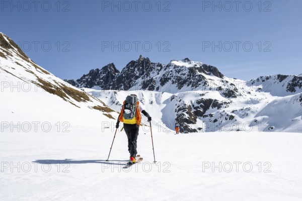 Ski tourers on the Graubünden Haute Route, Snow-covered mountains, Winter in the Albula Alps, Graubünden, Switzerland, Europe