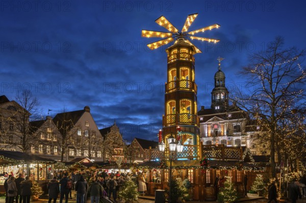 Large Christmas pyramid at the Christmas market on the market square, behind the historic town hall, Lüneburg, Lower Saxony, Germany, Europe