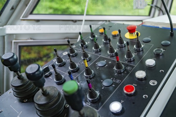 Detail of a control panel with numerous colour-coded levers and buttons, Hermann Hesse Bahn track construction, Calw district, Black Forest, Germany, Europe