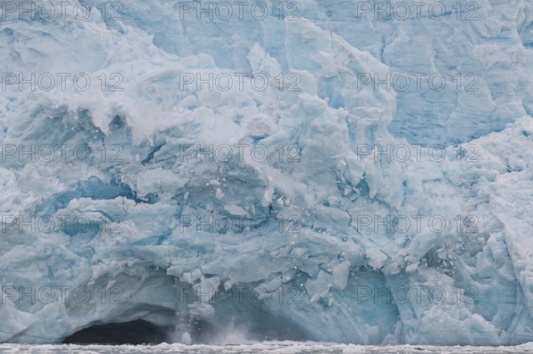 Calving glacier, edge of Monacobreen, Liefdefjord, Woodfjord area, Spitsbergen Island, Svalbard and Jan Mayen archipelago, Norway, Europe
