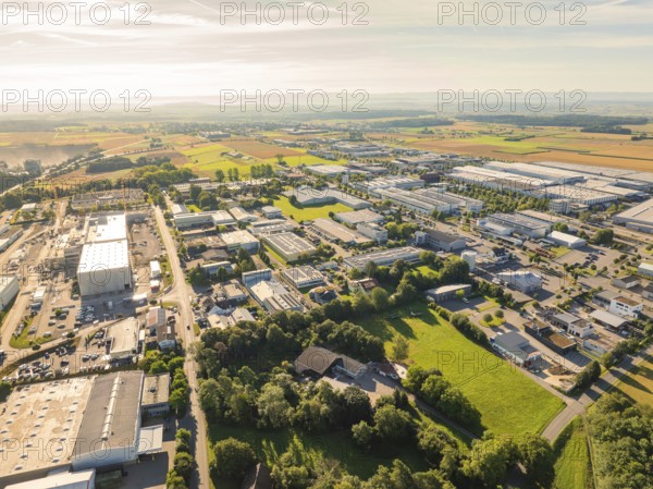 Industrial area surrounded by wide fields and a scenic environment under a blue sky, Industrial area Wolfsberg, Nagold, Black Forest, Germany, Europe