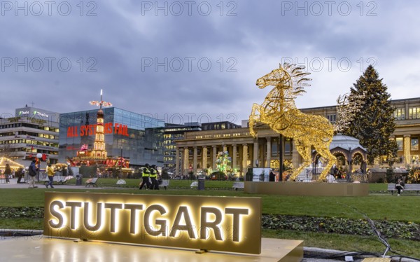Stuttgart Christmas market in the evening. Traditional event with more than 3.5 million visitors every year. Highlights present the sights of the state capital on the Schlossplatz. Königsbau and art museum. Stuttgart, Baden-Württemberg, Germany, Europe