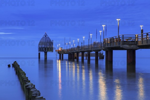 Dive gondola and Zingst pleasure pier, Seebrücke at dusk, Fischland-Darß-Zingst peninsula along the Baltic Sea, Mecklenburg-Vorpommern, Germany, Europe