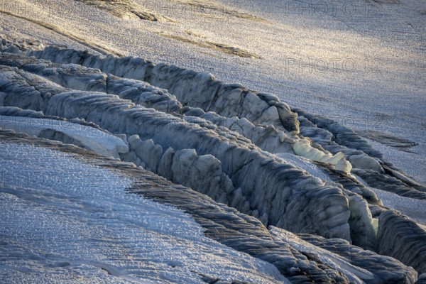 Glacier ice with crevasses in the evening light, Glacier du Tour at sunset, High alpine mountain landscape, Chamonix, Haute-Savoie, France, Europe