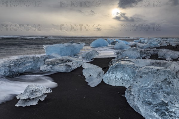 Ice floes on the beach, waves, sea, clouds, sunlight, winter, Diamond Beach, Breidamerkursandur, Jökulsarlon, Iceland, Europe