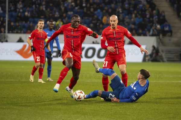 Football UEFA Europa League, 2024/25 season, matchday 6: TSG Hoffenheim v Steaua Bucharest. Photo: Foul by Joyskim Dawa (5, Bucharest) on Adam Hlozek (23, Hoffenheim)