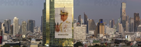Panorama from the viewing platform of the Iconsiam on CAT Tower with huge billboard of the Thai King Maha Vajiralongkorn, skyscrapers, hotels and the banking district Bang Rak, skyline of Bangkok, Thailand, Asia
