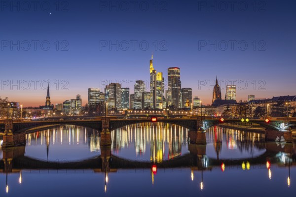 The lights of Frankfurt's banking skyline glow in the evening after sunset, Frankfurt am Main, Hesse, Germany, Europe
