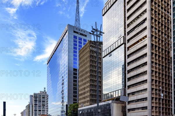 Commercial buildings with glass facades reflecting the sky on Paulista Avenue in Sao Paulo, Sao Paulo, Sao Paulo, Brazil, South America