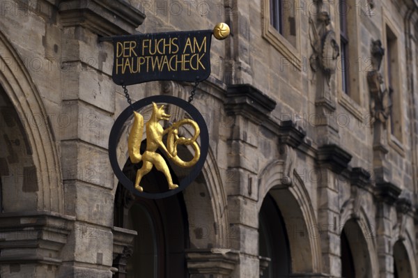 Fox with pretzel, nose sign of the bakery Der Fuchs am Hauptwacheck, café, Bamberg, Upper Franconia, Bavaria, Germany, Europe