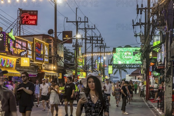 Crowds of people on Bangla Street in the evening. Nightlife on Bangla Walking Street with go-go bars, clubs, cannabis bars and extreme loudness. Patong, Kathu, Phuket Island, Thailand, Asia