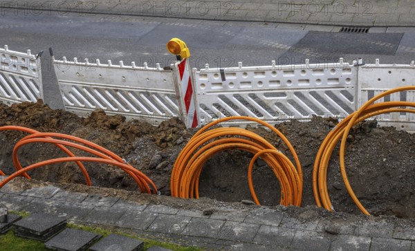 Mülheim an der Ruhr, North Rhine-Westphalia, Germany - Internet broadband expansion, Westnetz construction site laying fibre optic cable, fast Internet, DSL cable connection for households
