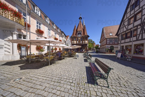 Market square with historic town hall, benches and outdoor area of a café in Michelstadt, Odenwald, Odenwaldkreis, Hesse, Germany, Europe